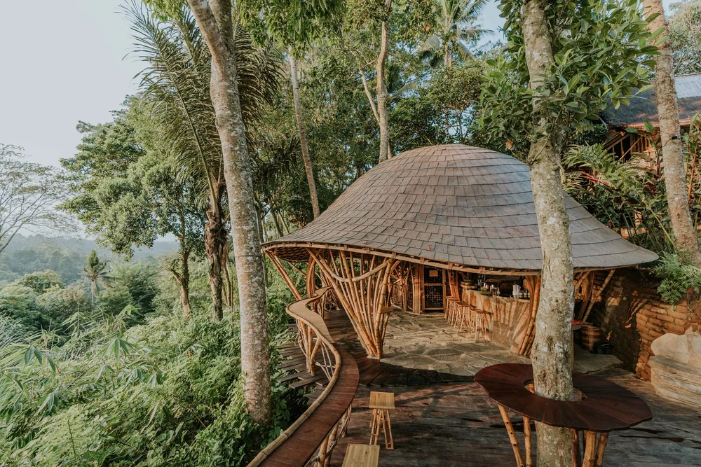 Open-air bamboo bar pavilion overlooking the jungle ridge